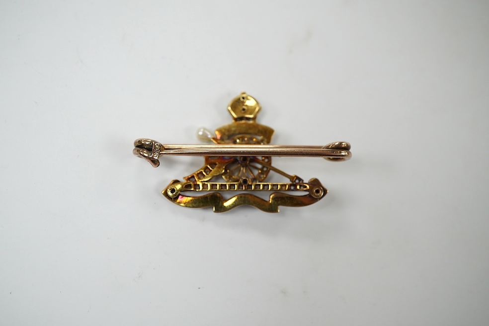 A cased early 20th century 9c, enamel and diamond set Royal Artillery sweethearts brooch, 37mm, gross weight 6.3 grams. Condition - good